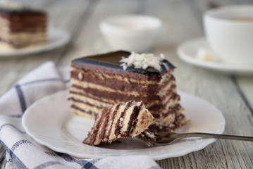 Delicious dessert cake with chocolate cream and coffee