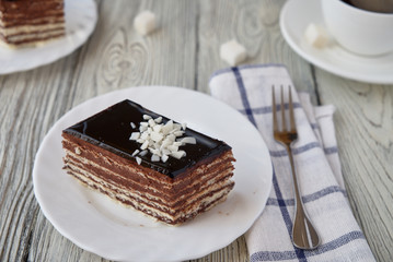 Delicious dessert cake with chocolate cream and coffee