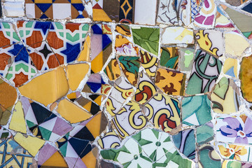 Broken glass mosaic tile, decoration in Park Guell, Barcelona, Spain.