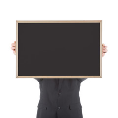 Business man holding empty chalkboard before his head