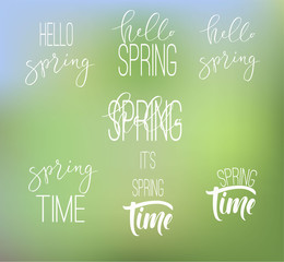 Set of calligraphic signs on blurred background. Phrases about spring.