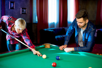 two men playing billiard