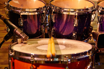 Fototapeta na wymiar Drums set and sticks, close-up, selective focus