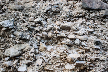 Rock and gravel wall texture in forest