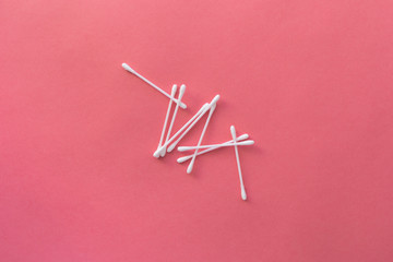 cotton swabs and sponge. Hygiene Red background
