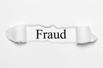 Fraud on white torn paper