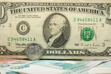 The inscription on the ten ten-dollar bill covered ruble coin