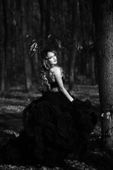 elegant young woman in forest