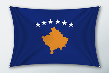 Kosovo national flag. Symbol of the country on a stretched fabric with waves attached with pins. Realistic vector illustration.