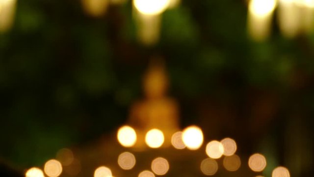 buddha image statue and candle light - blur for background