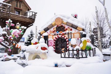 A candy house covered with snow