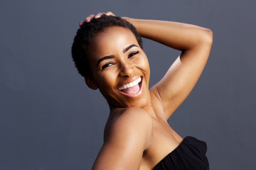 smiling female fashion model with hand in hair
