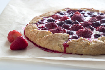 Berry Tart. Galette with summer berries. Pie with strawberry and cherry