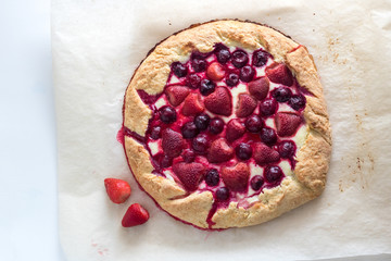 Berry Tart. Galette with summer berries. Pie with strawberry and cherry