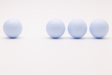 White golf balls on the white background.