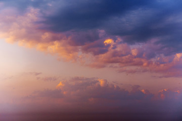 Romantic fantastic colorful clouds evening sky texture with diff