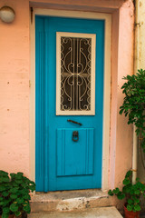 Fototapeta na wymiar old blue wooden vintage painted door of greek island, Crete, Greece, traditional colorful facade