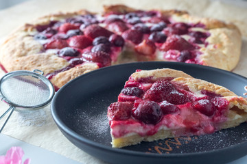 Berry Tart. Galette with summer berries. Pie with strawberry and cherry