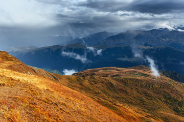 Snow-covered mountains in the mist. Autumn at Koruldi Lake. Euro