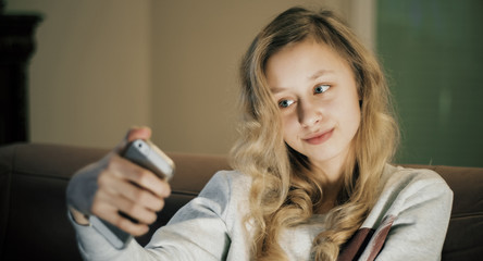 Selfie portrait, girl with smart phone