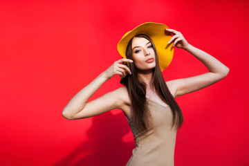 Beautiful young woman in yellow hat