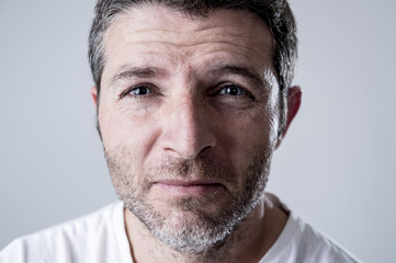 man with blue eyes sad and depressed looking lonely and suffering depression feeling sorrow