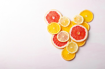 Citrus fruit Heart from slices of lemon, orange, grapefruit on white background. Love, healthy, ecology concept.