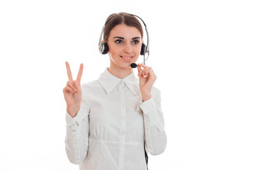 horizontal portrait of young cheerful call office worker girl with headphones and microphone isolated on white background