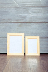 Fototapeta premium photo frames on the wooden wall
