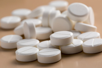 Heap of round white pills