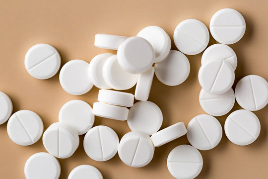 Heap of round white pills