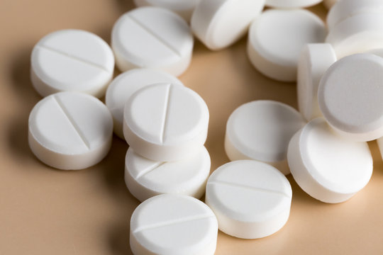 Heap of round white pills