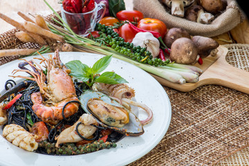 Black spaghetti Alle Vongole. Black seafood pasta with clams and