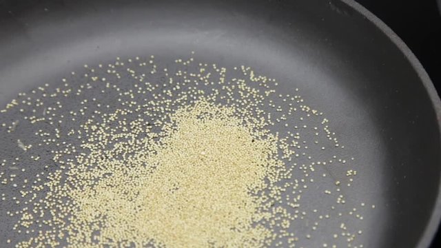 Amaranth being popped in cast-iron pan Popped Amaranth Homemade