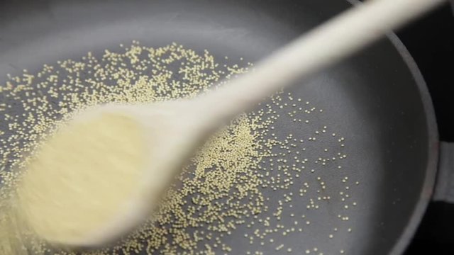 Amaranth being popped in cast-iron pan Popped Amaranth Homemade