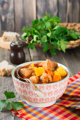 Meat soup estofado with potatoes, carrots and seasonings. Traditional Mexican dishes. Selective focus.