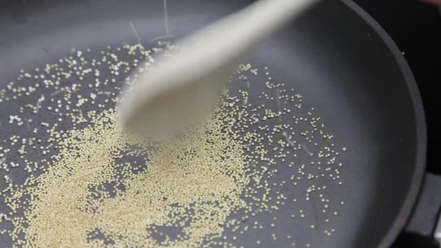 Amaranth being popped in cast-iron pan Popped Amaranth Homemade
