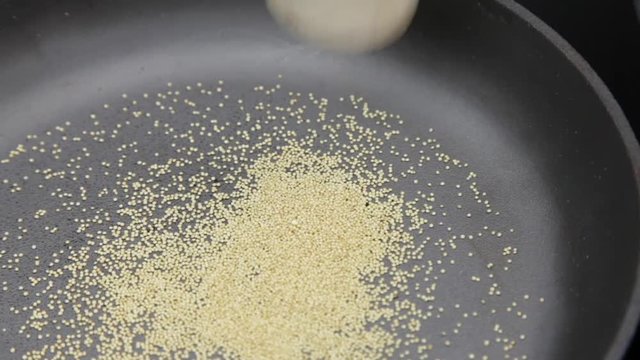 Amaranth being popped in cast-iron pan Popped Amaranth Homemade