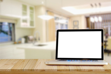 Smart Display Concept. Mock up laptop on wood table in modern kitchen room. for product montage  display.