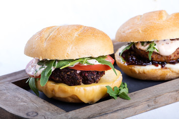 Two different fresh tasty burgers