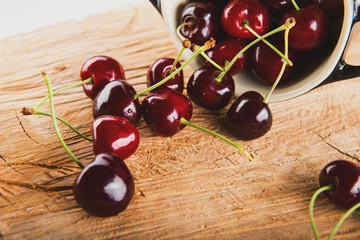 Juicy cherries in black vessel