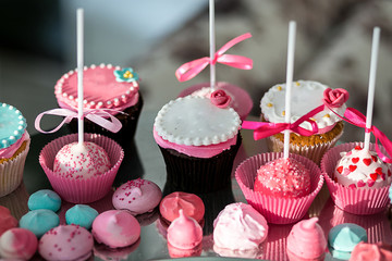 Candy Bar. Delicious sweet buffet with cupcakes. Sweet holiday buffet with cupcakes and other desserts.Table with sweets, candies, dessert,happy birthday concept