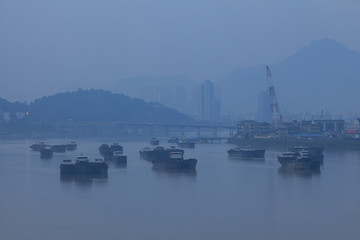 a ship in ou river, haze, fog, bad air condition