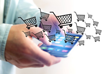 Virtual trolley going out of a smartphone - shopping online conc