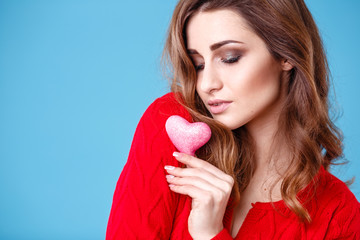 Love and valentines day woman holding red and pink hearts