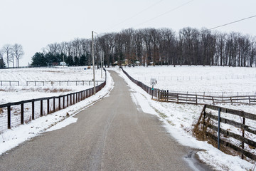 Road and snow covered fields, near New Freedom, Pennsylvania.