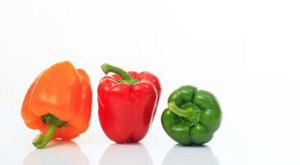 Colorful bell peppers on white background