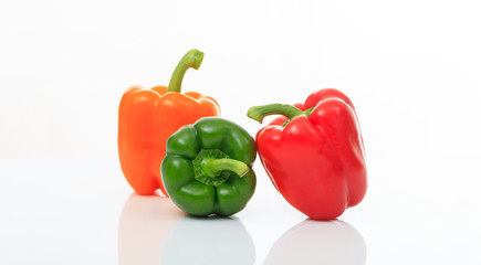 Colorful bell peppers on white background