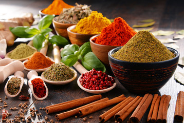 Variety of spices and herbs on kitchen table