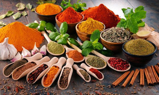 Fototapeta Variety of spices and herbs on kitchen table